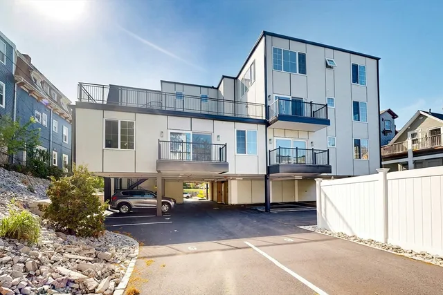 a view of a house with pool and sitting area