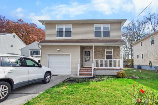 a view of a car parked in front of a house