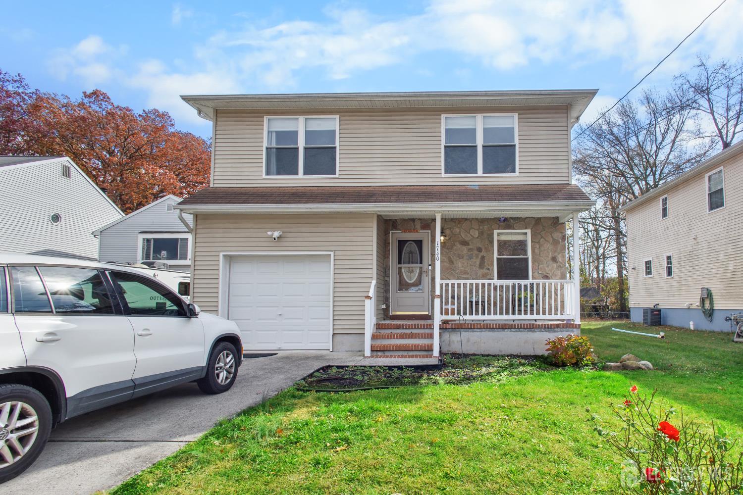 a view of a car parked in front of a house