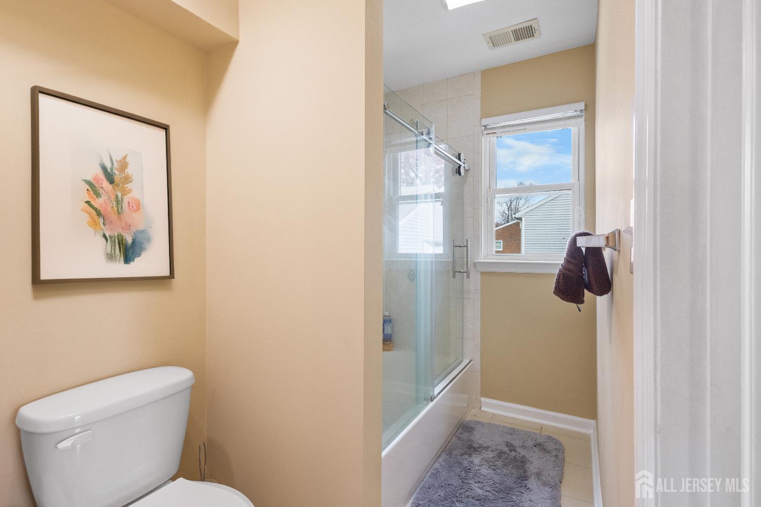 1740 Holly Road North Brunswick, NJ 08902 - Photo 17 of 32 a bathroom with a toilet and a shower