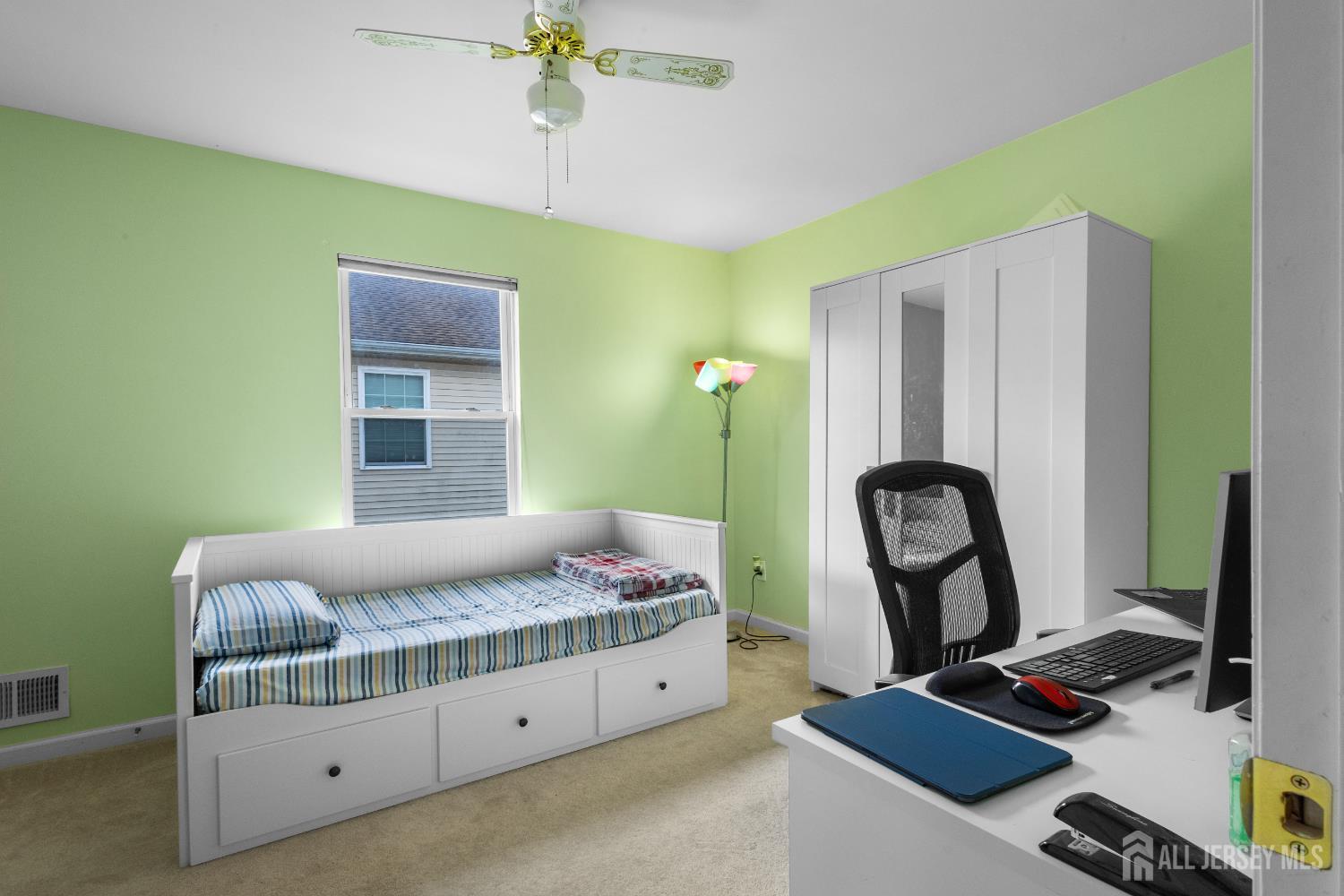 1740 Holly Road North Brunswick, NJ 08902 - Photo 18 of 32 a bedroom with a bed and a potted plant