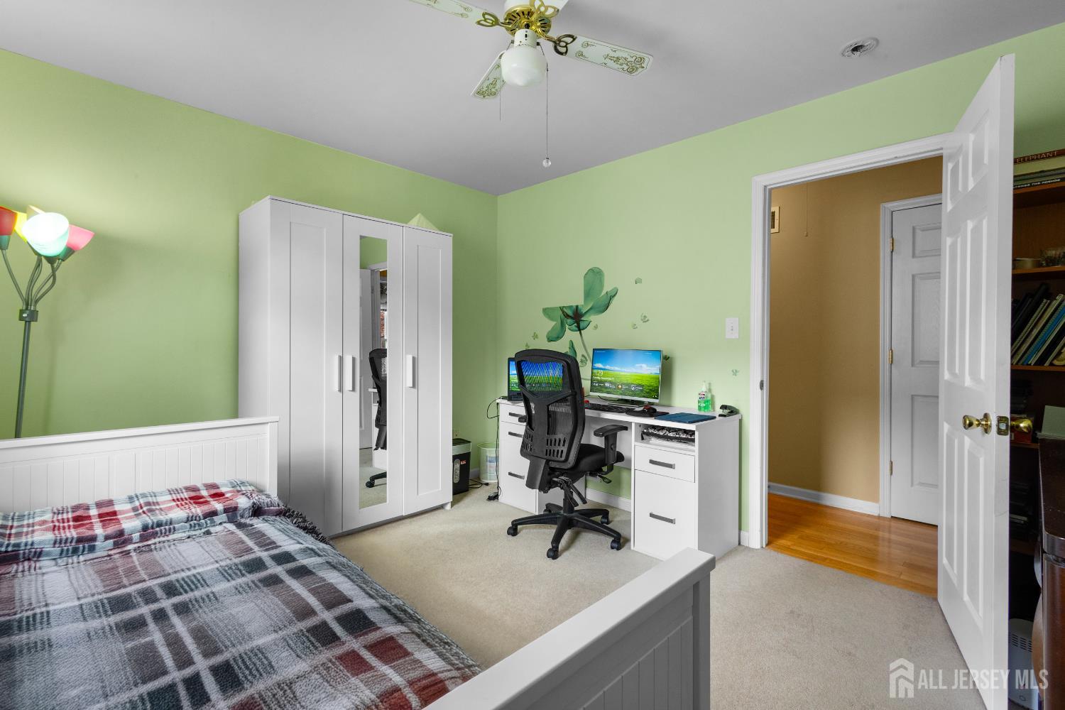 1740 Holly Road North Brunswick, NJ 08902 - Photo 20 of 32 a view of a workspace with furniture and a chandelier