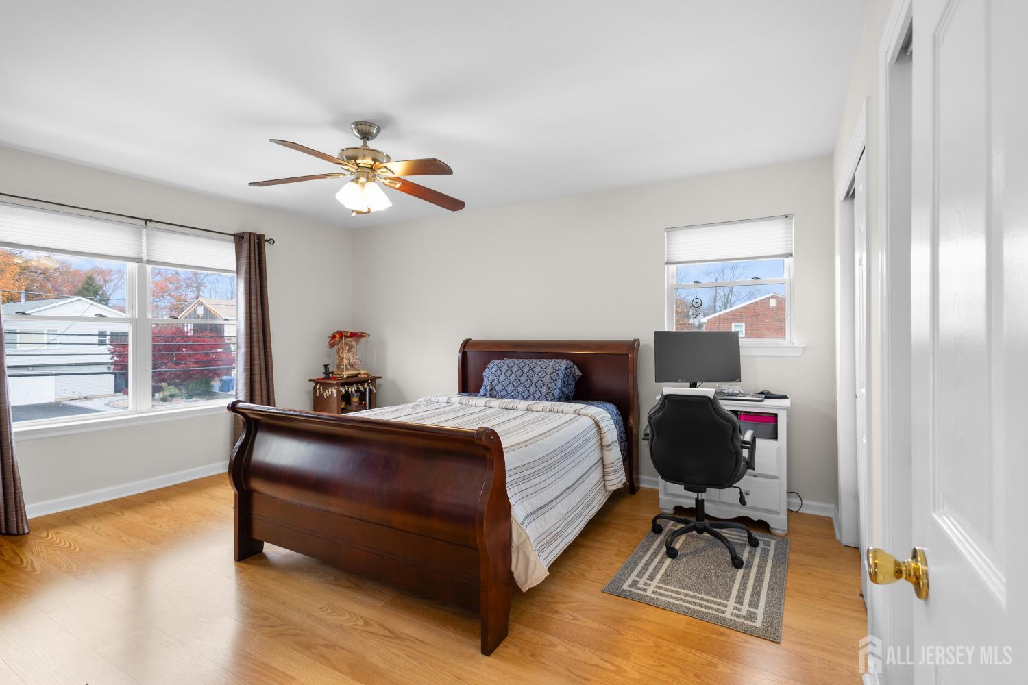 1740 Holly Road North Brunswick, NJ 08902 - Photo 21 of 32 a bedroom with a bed and a chandelier