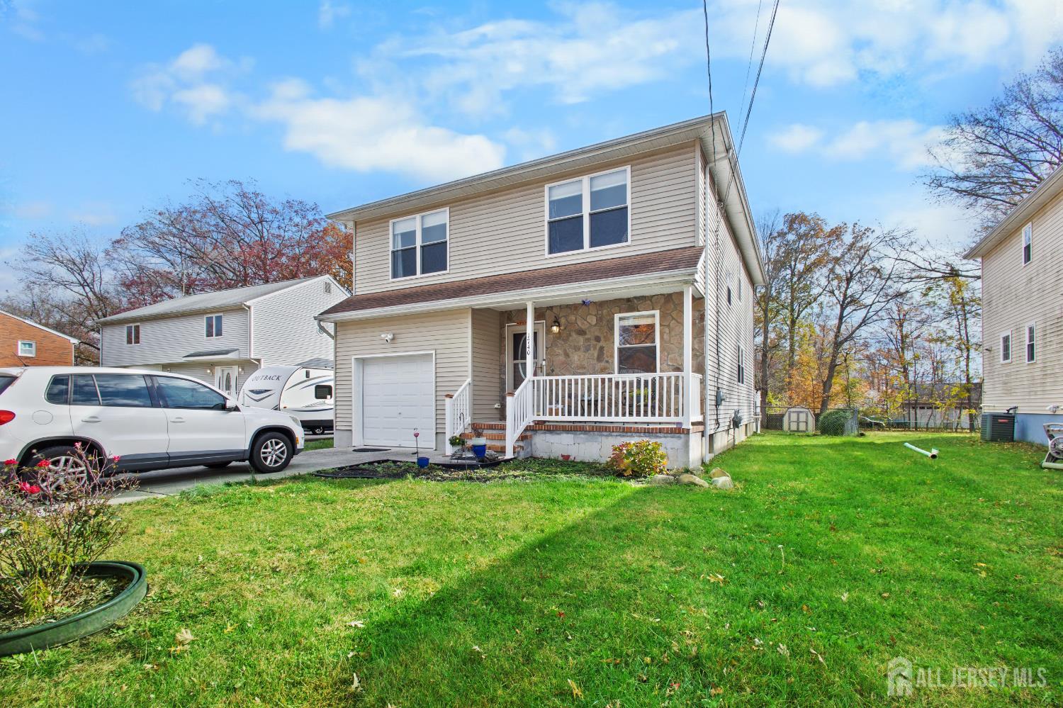 1740 Holly Road North Brunswick, NJ 08902 - Photo 3 of 32 a view of a house with a yard
