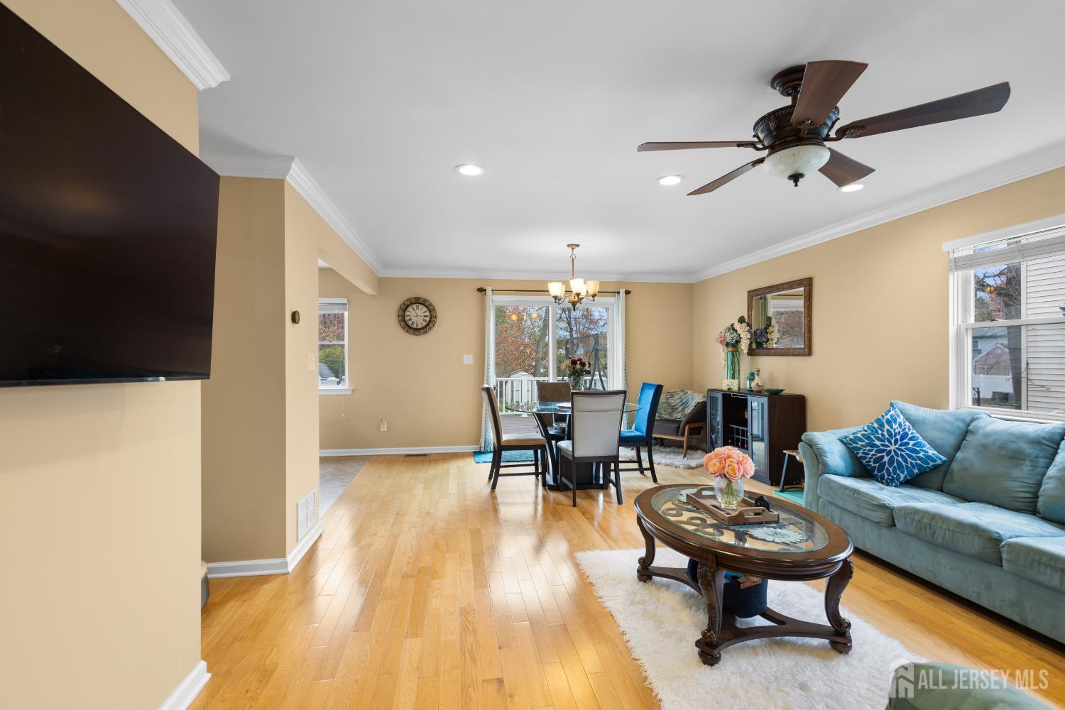 1740 Holly Road North Brunswick, NJ 08902 - Photo 5 of 32 a living room with furniture and a flat screen tv