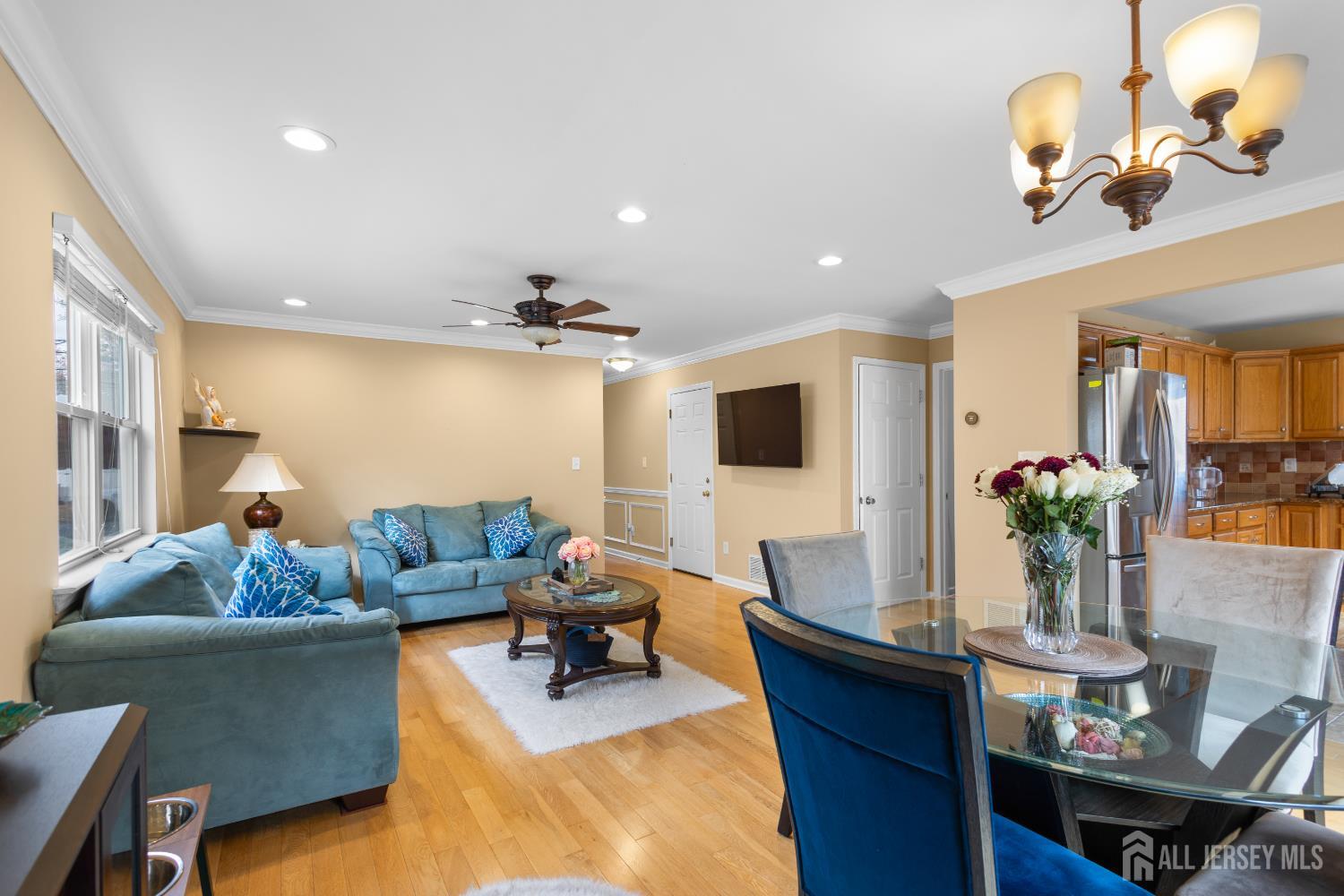 1740 Holly Road North Brunswick, NJ 08902 - Photo 6 of 32 a living room with furniture and a flat screen tv