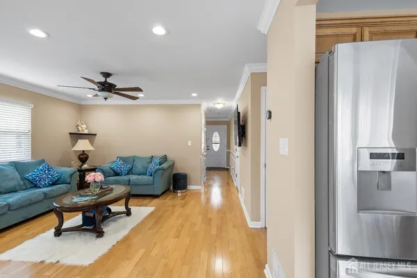 a living room with furniture and a rug