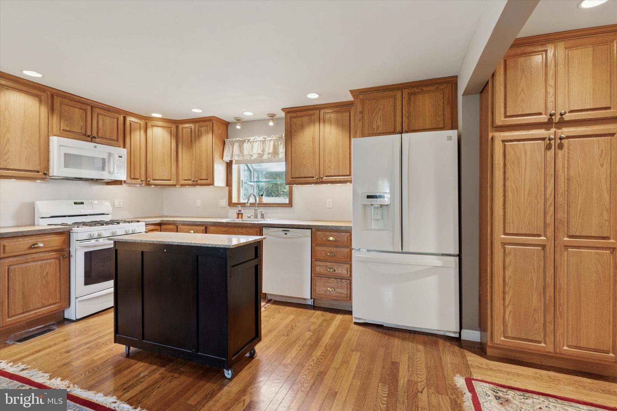 1500 Allen Road Oreland, PA 19075 - Photo 11 of 49 a kitchen with wooden cabinets and stainless steel appliances