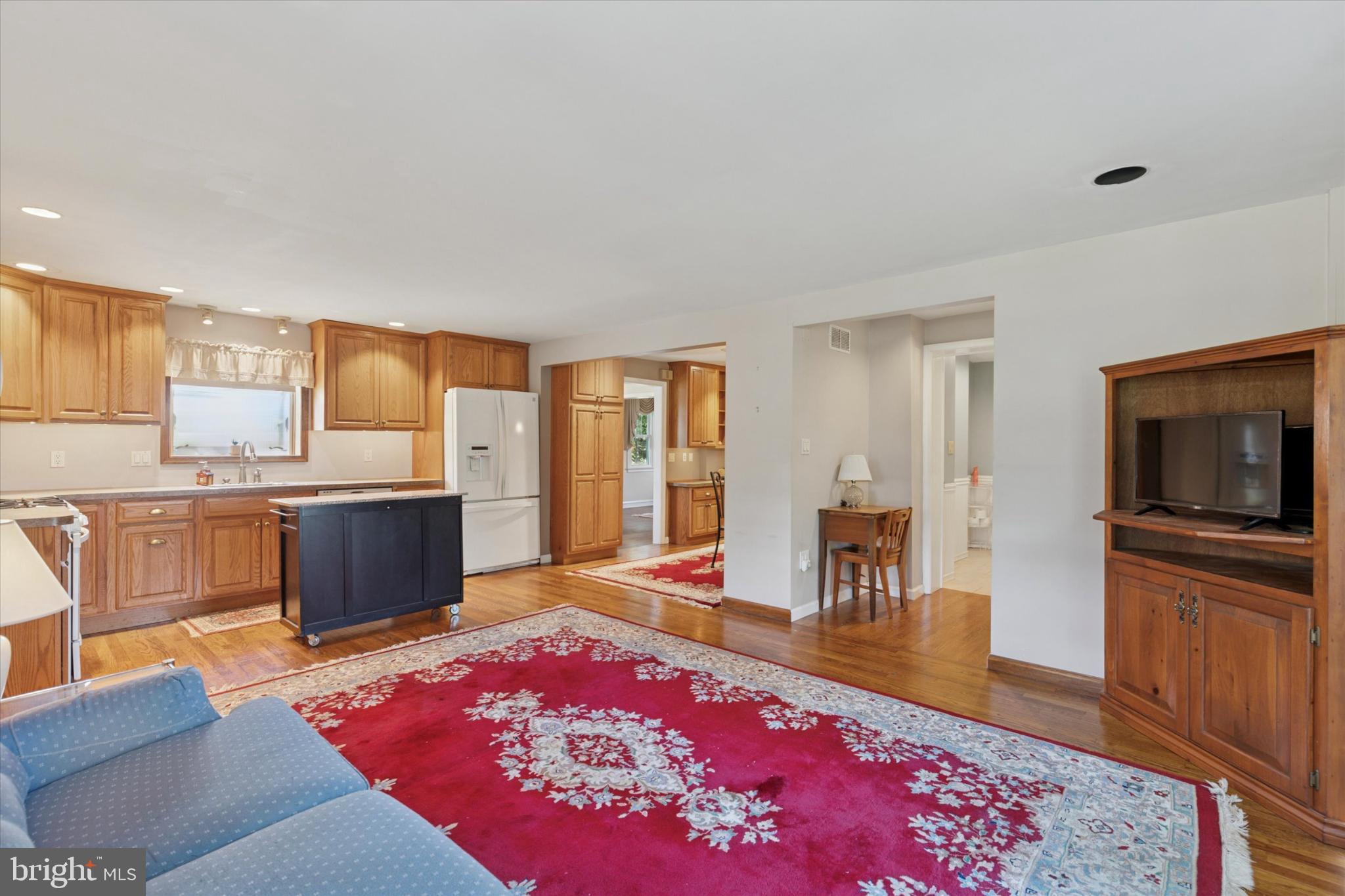 1500 Allen Road Oreland, PA 19075 - Photo 13 of 49 a living room with stainless steel appliances furniture rug and wooden floor