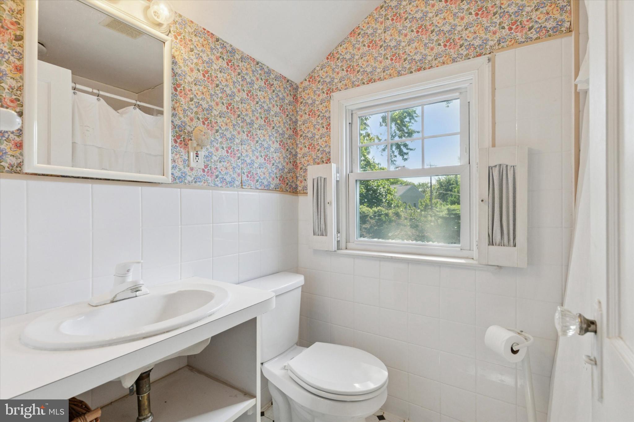1500 Allen Road Oreland, PA 19075 - Photo 27 of 49 a bathroom with a toilet a sink and a window