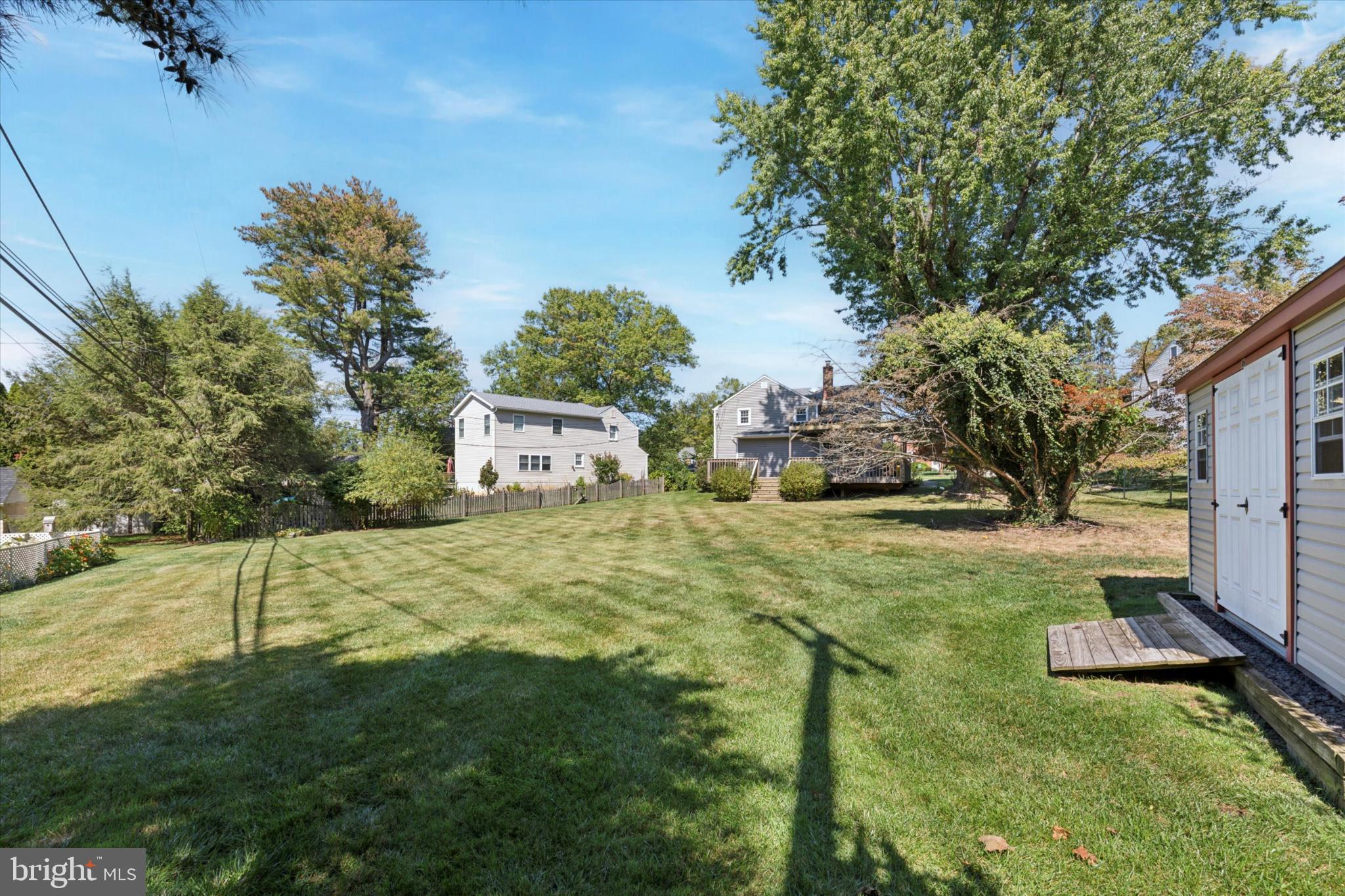 1500 Allen Road Oreland, PA 19075 - Photo 35 of 49 a yellow house with trees in front of it