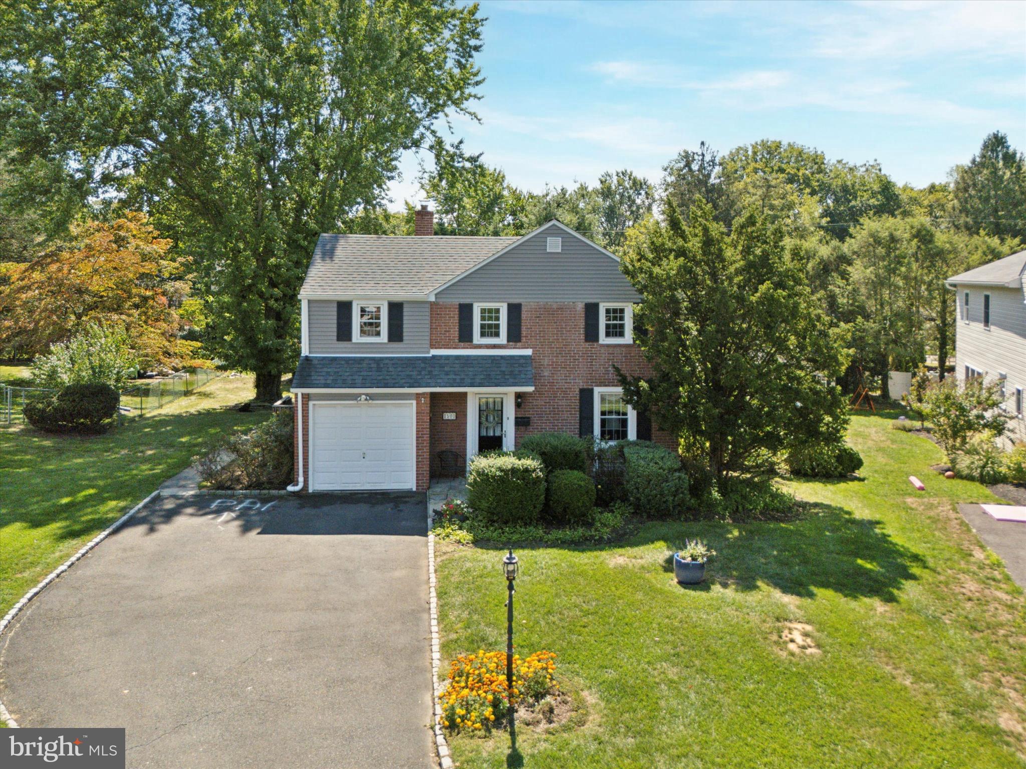 1500 Allen Road Oreland, PA 19075 - Photo 39 of 49 a front view of a house with a yard and garage