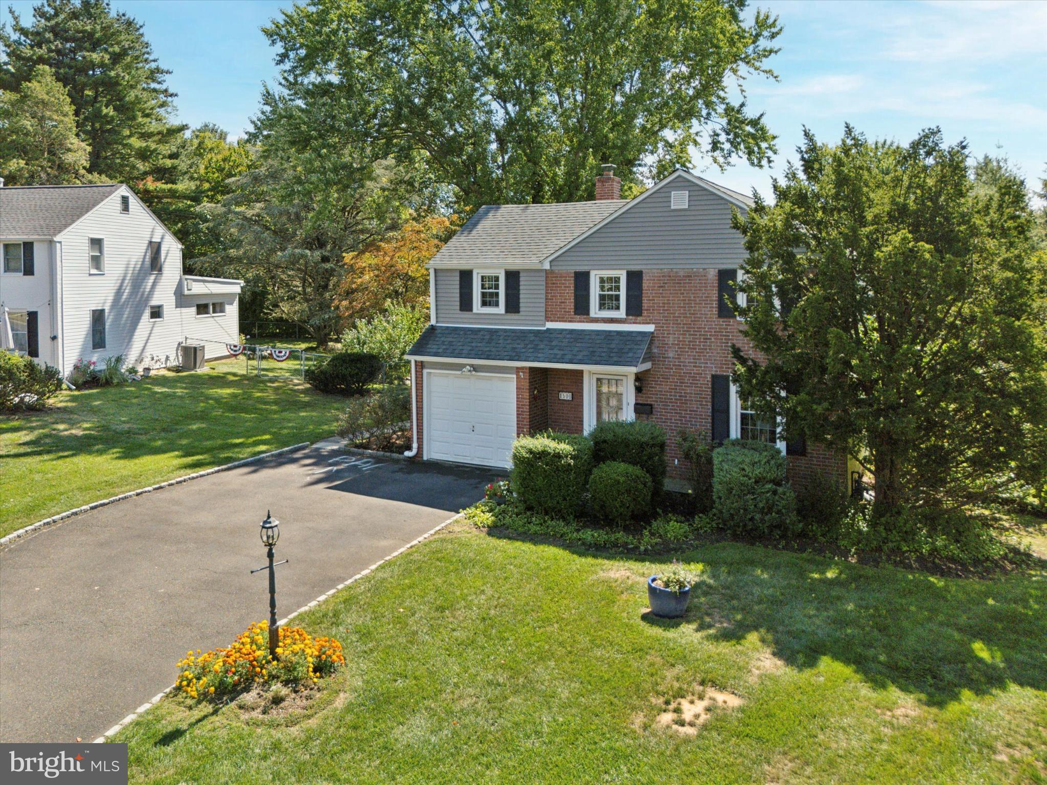 1500 Allen Road Oreland, PA 19075 - Photo 40 of 49 a front view of a house with a garden