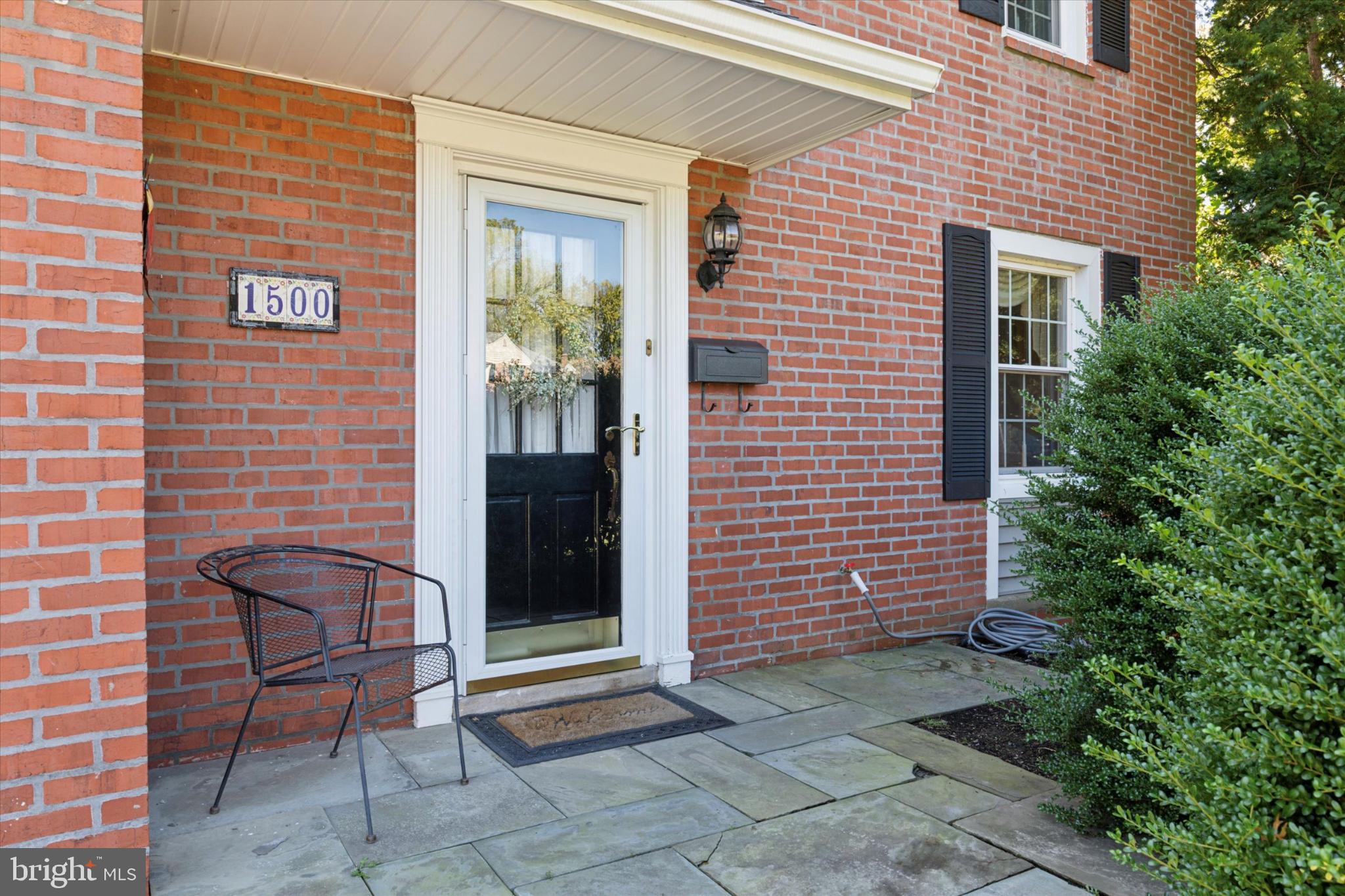 1500 Allen Road Oreland, PA 19075 - Photo 4 of 49 a brick building with a bench and a potted plant