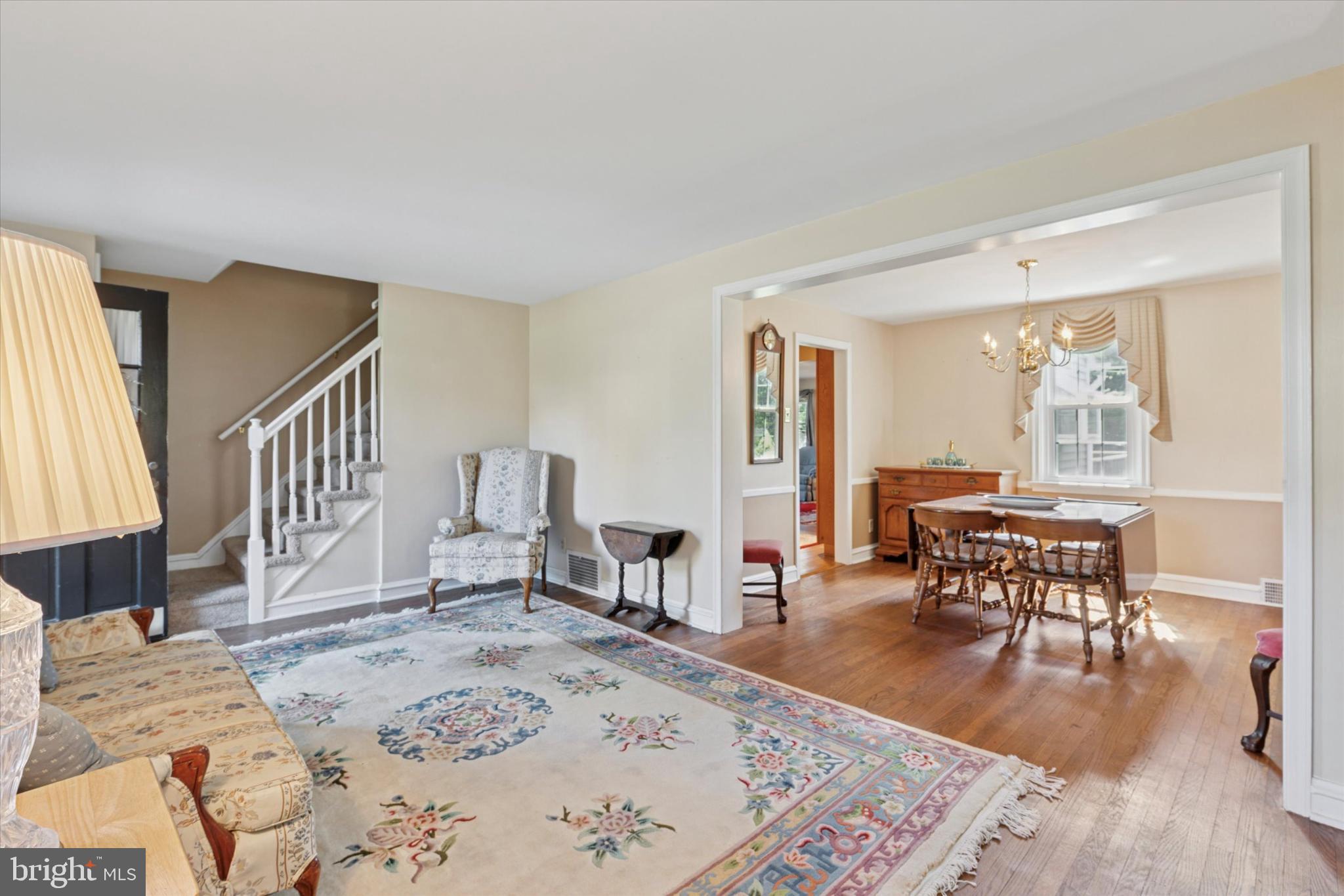 1500 Allen Road Oreland, PA 19075 - Photo 6 of 49 a living room with furniture and a dining table with wooden floor