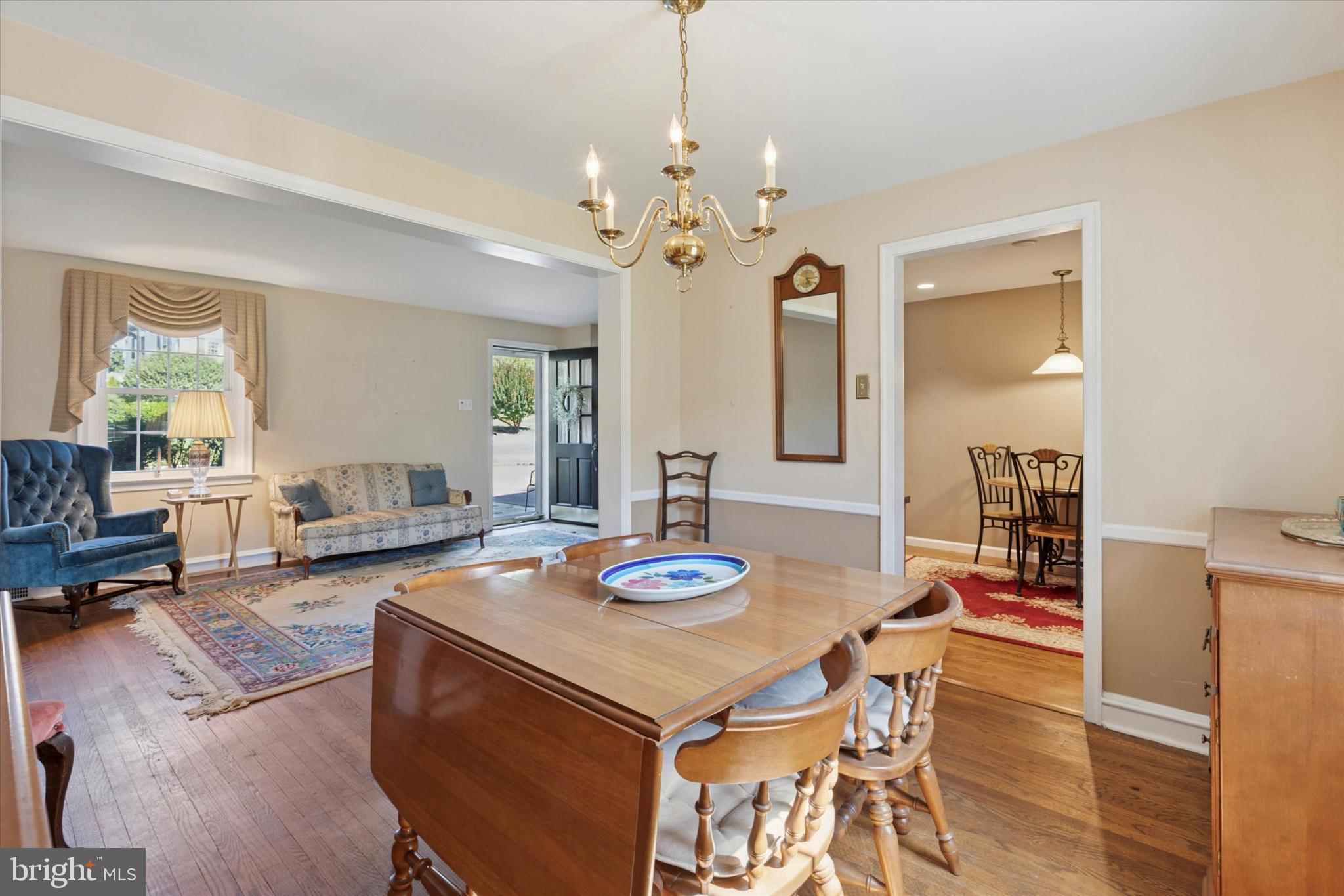 1500 Allen Road Oreland, PA 19075 - Photo 9 of 49 a living room with dining table and a chandelier