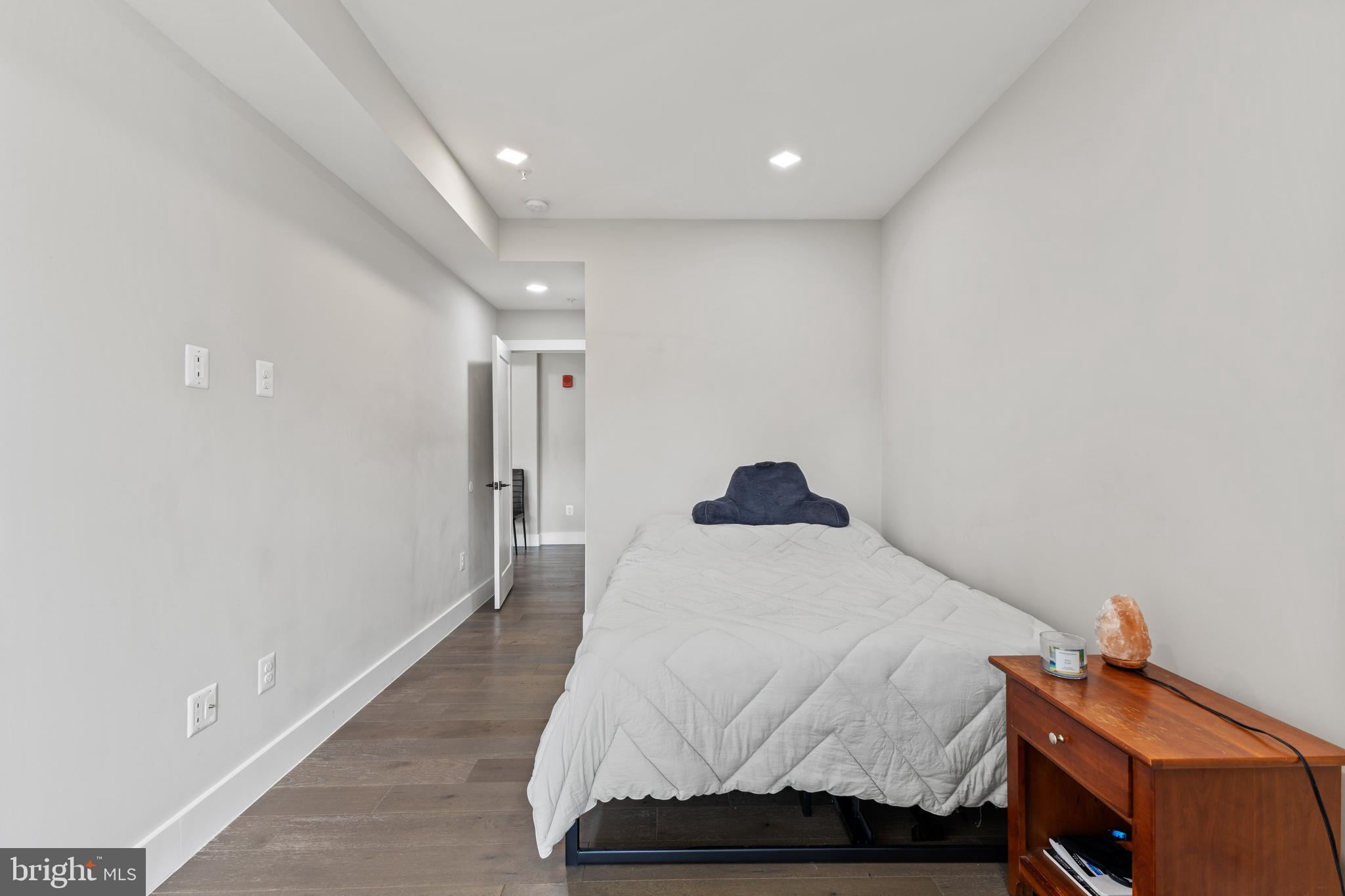 1028 Bladensburg Road Northeast, Unit 37 Washington, DC 20002 - Photo 13 of 29 a bedroom with a bed and a window