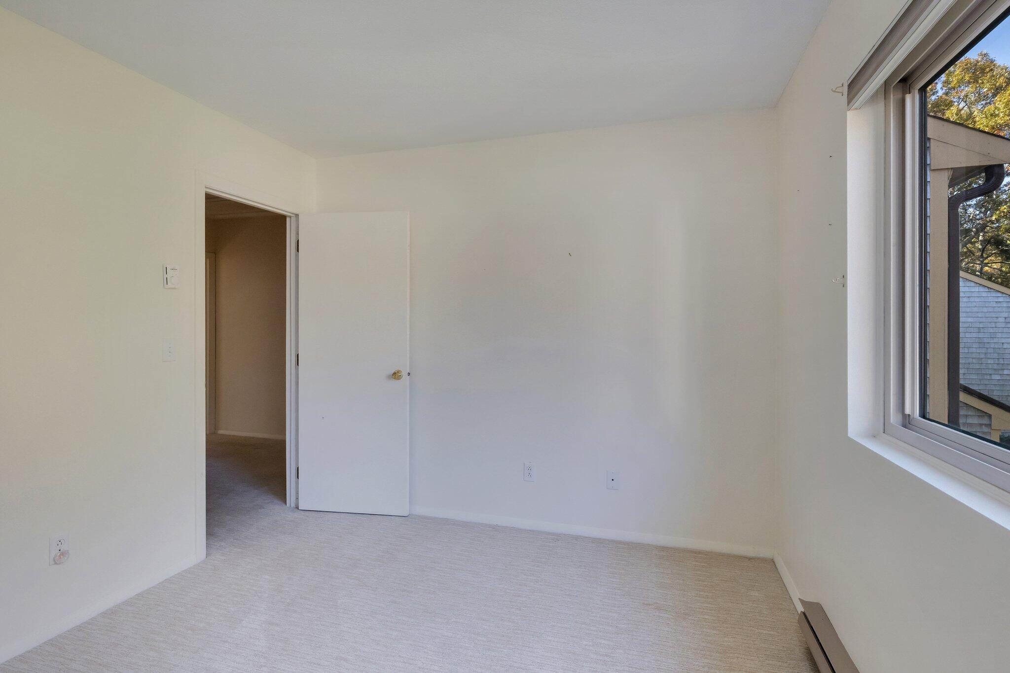 81 Round House Road Bourne, MA 02532 - Photo 20 of 32 a view of an empty room and a window