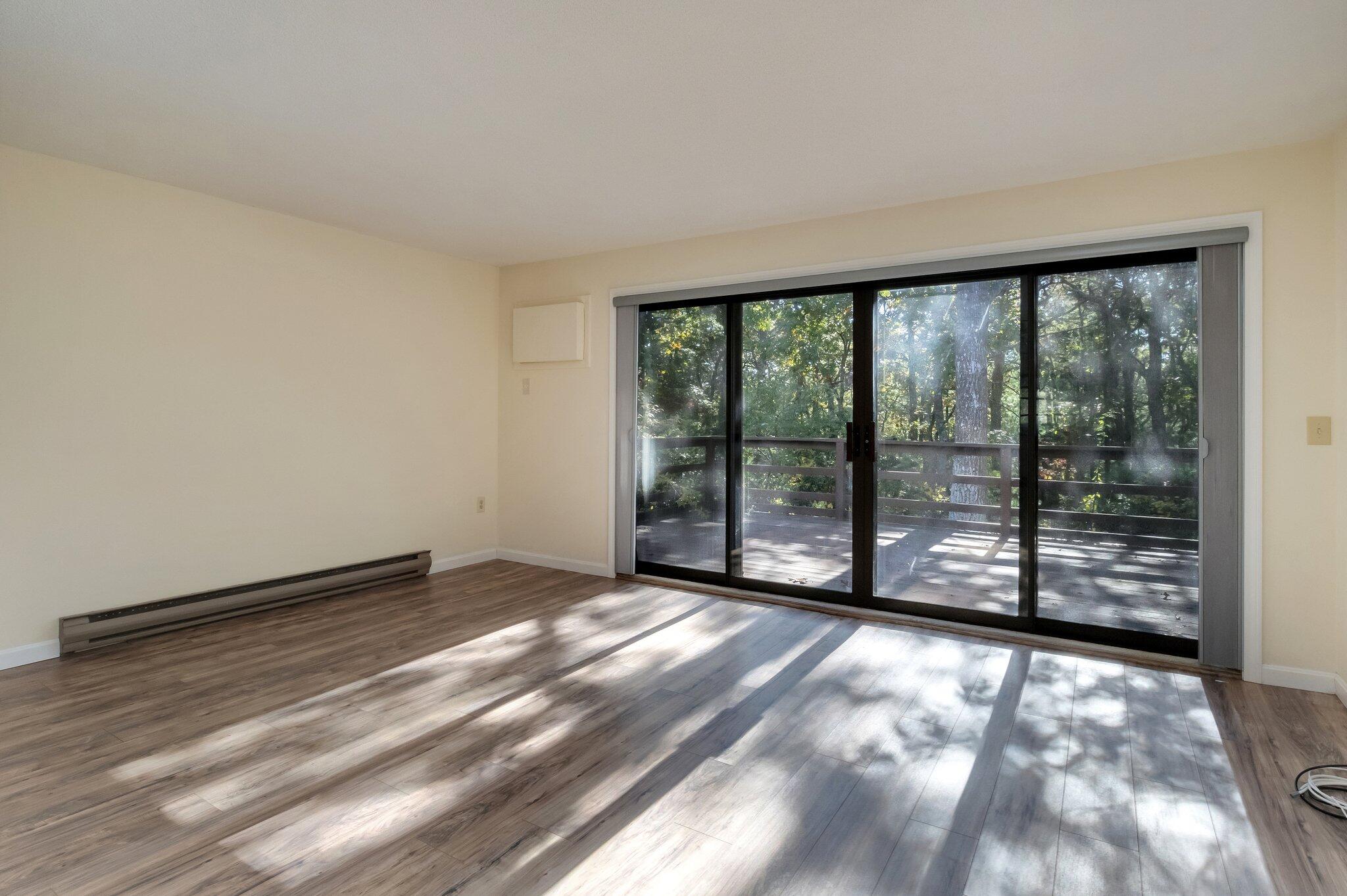 81 Round House Road Bourne, MA 02532 - Photo 5 of 32 a view of an empty room with a balcony
