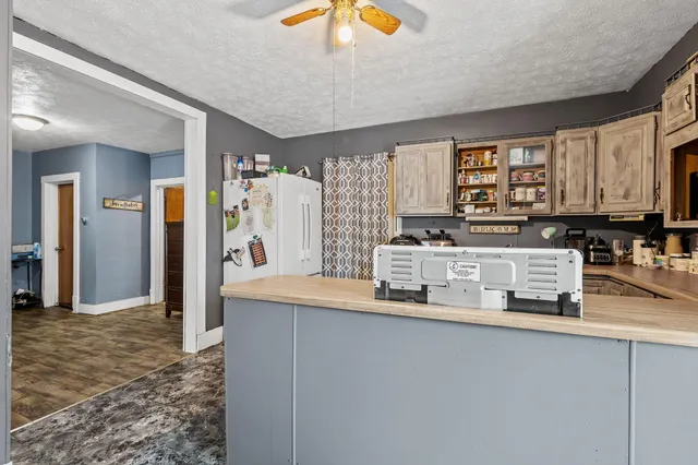 a kitchen with stainless steel appliances granite countertop a sink and cabinets