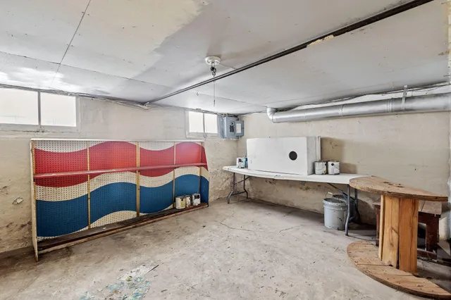 a utility room with multiple dryer and washer