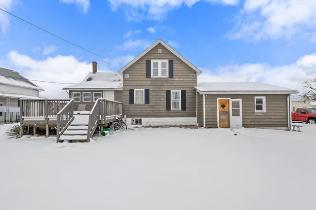 a front view of a house with a patio