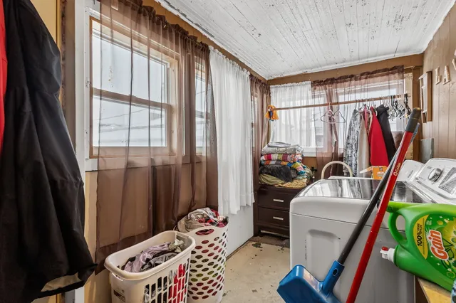 a view of a bedroom with a window and storage
