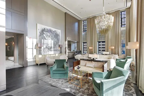 a bathroom with a toilet and a mirror