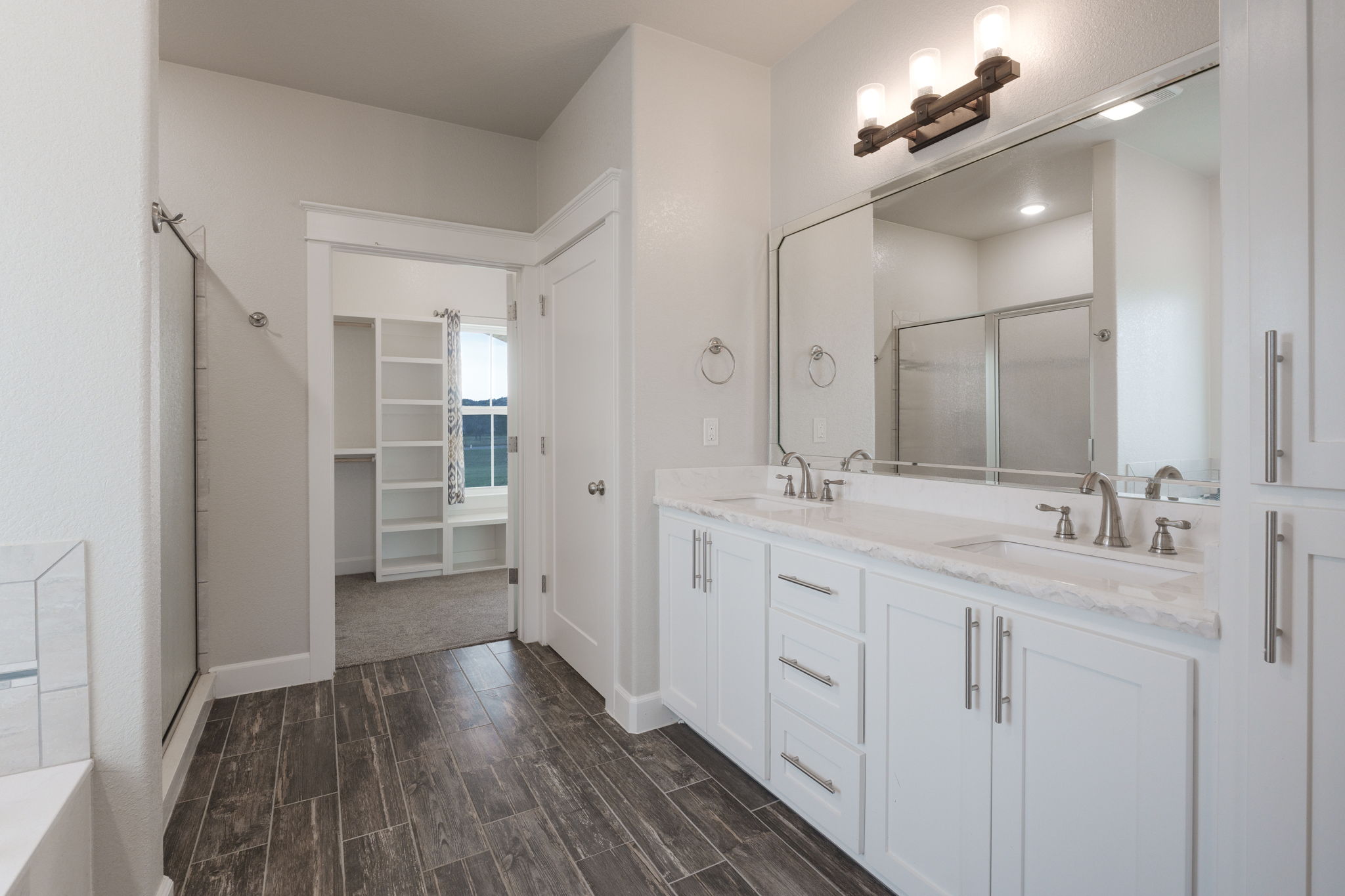 2662 Snow Road Kempner, TX 76539 - Photo 18 of 28 a spacious bathroom with a double vanity sink a mirror and shower