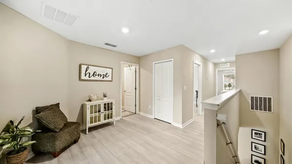 a view of a livingroom with furniture and workspace