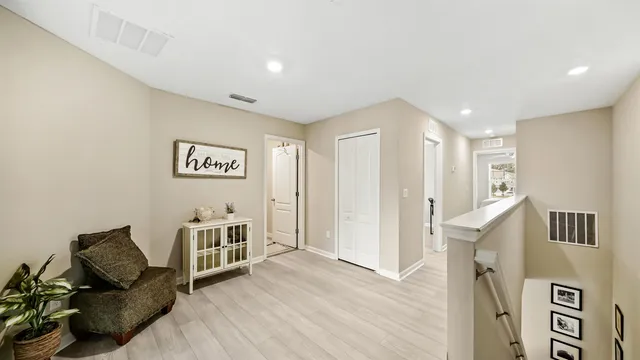 a view of a livingroom with furniture and workspace