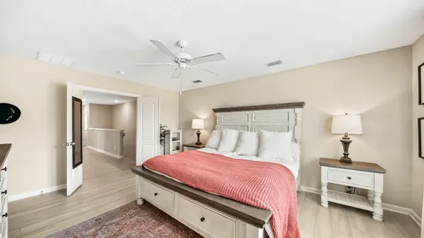 a bedroom with a bed and a table