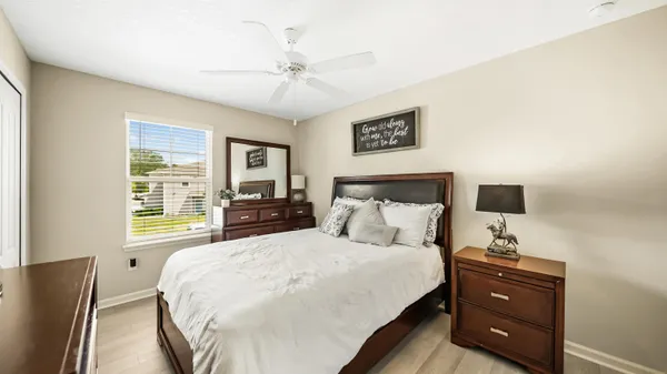 a bedroom with a bed and a tv