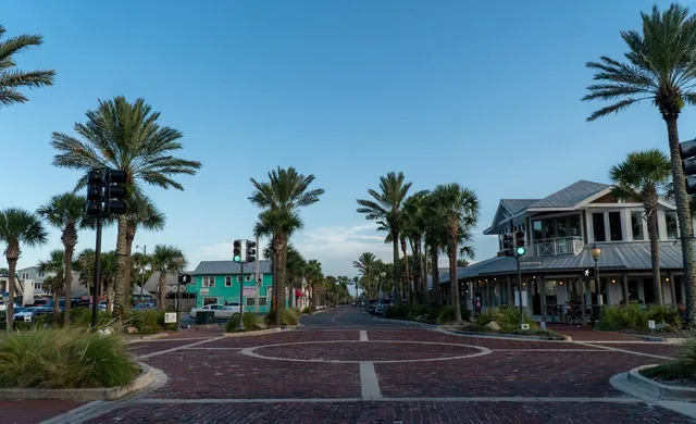 a front view of multiple houses with yard