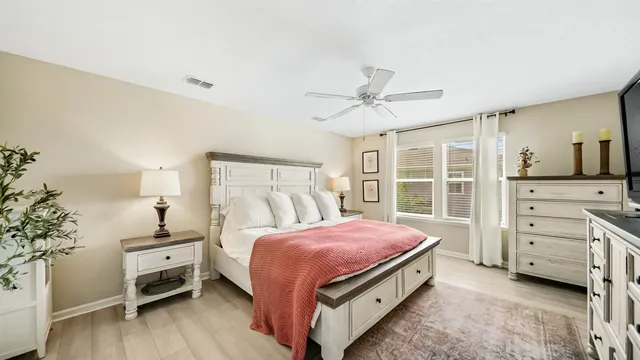 a bedroom with a bed and a dresser