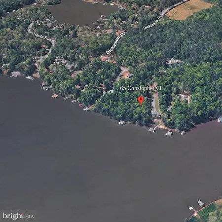 an aerial view of a houses with a street