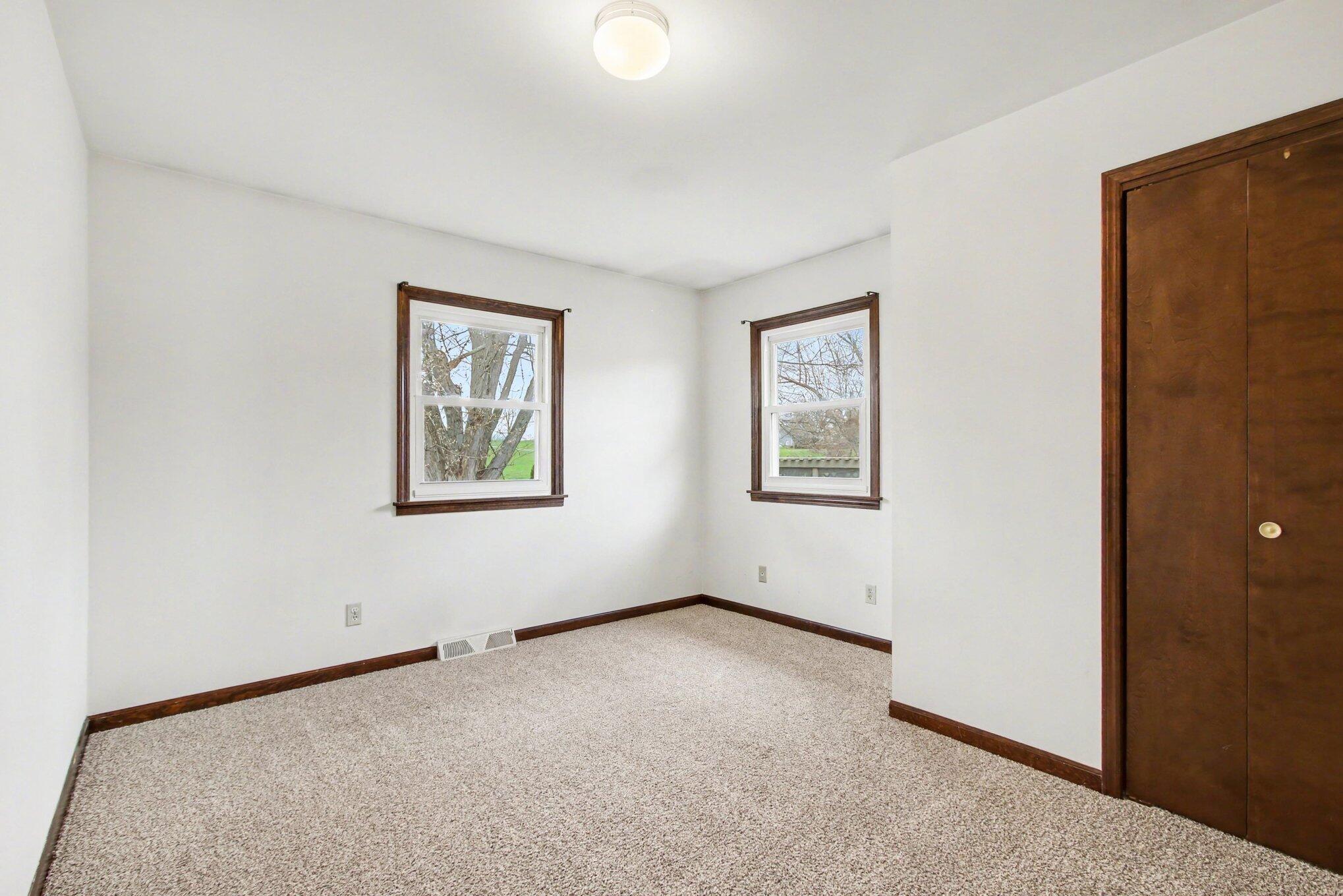 1379 Leeward Road Crown Point, IN 46307 - Photo 19 of 39 an empty room with windows and closet
