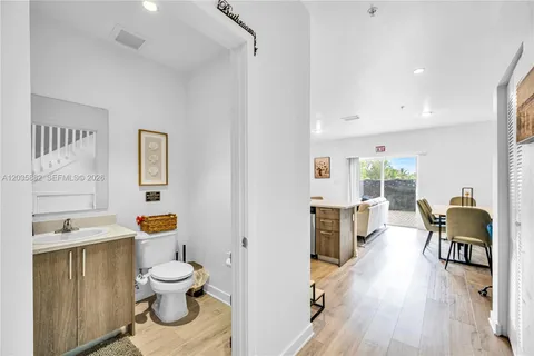 a bathroom with a sink a toilet and mirror