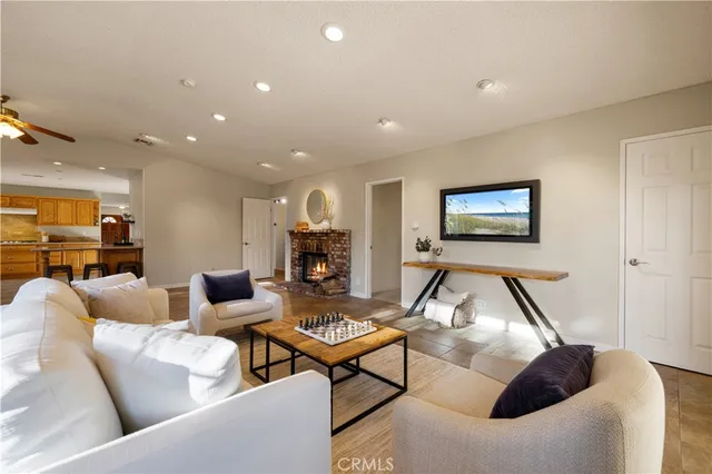a living room with furniture and a fireplace