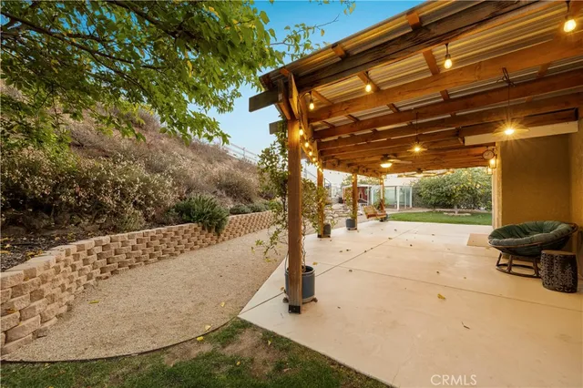 a view of a pathway of a house with a tree