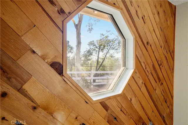 a living room with furniture and large windows