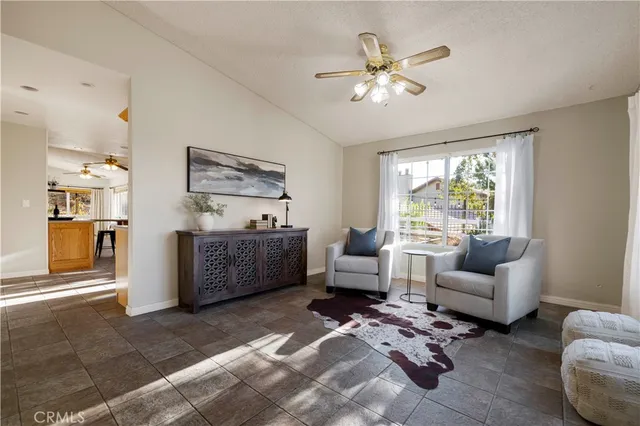 a kitchen with stainless steel appliances granite countertop a refrigerator a stove and a sink