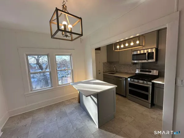 a kitchen with a stove and a microwave