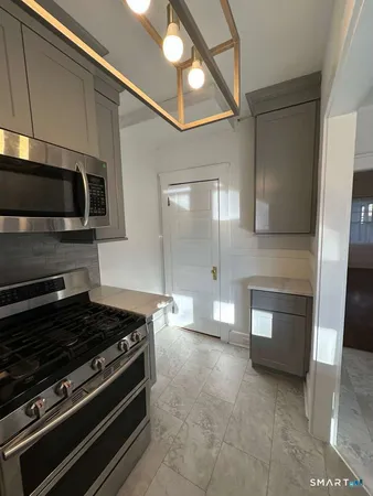 a kitchen with a stove and a microwave