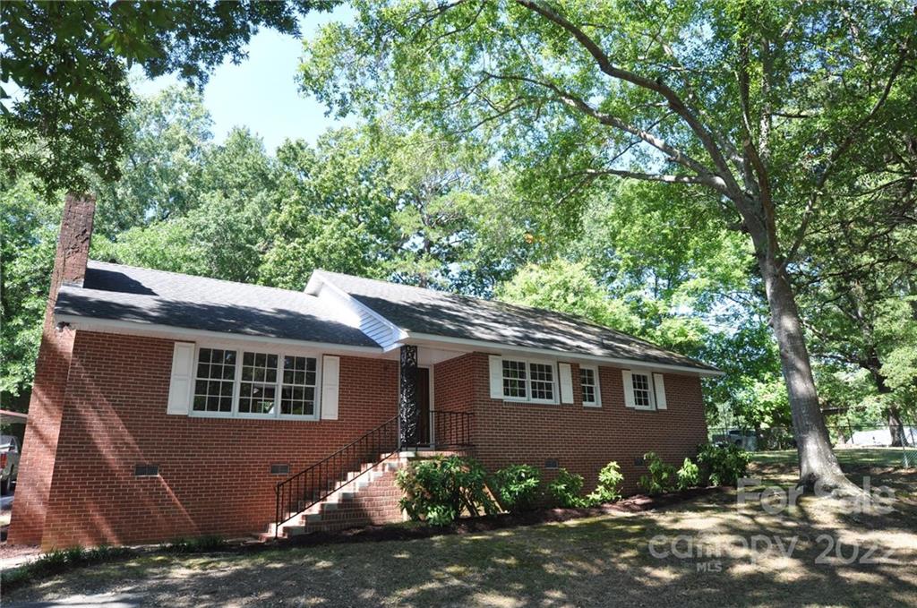 103 Sunset Drive Chester, SC 29706 - Photo 1 of 19 a front view of a house with a garden