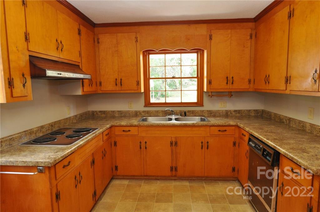 103 Sunset Drive Chester, SC 29706 - Photo 2 of 19 a kitchen with stainless steel appliances granite countertop a sink stove and cabinets