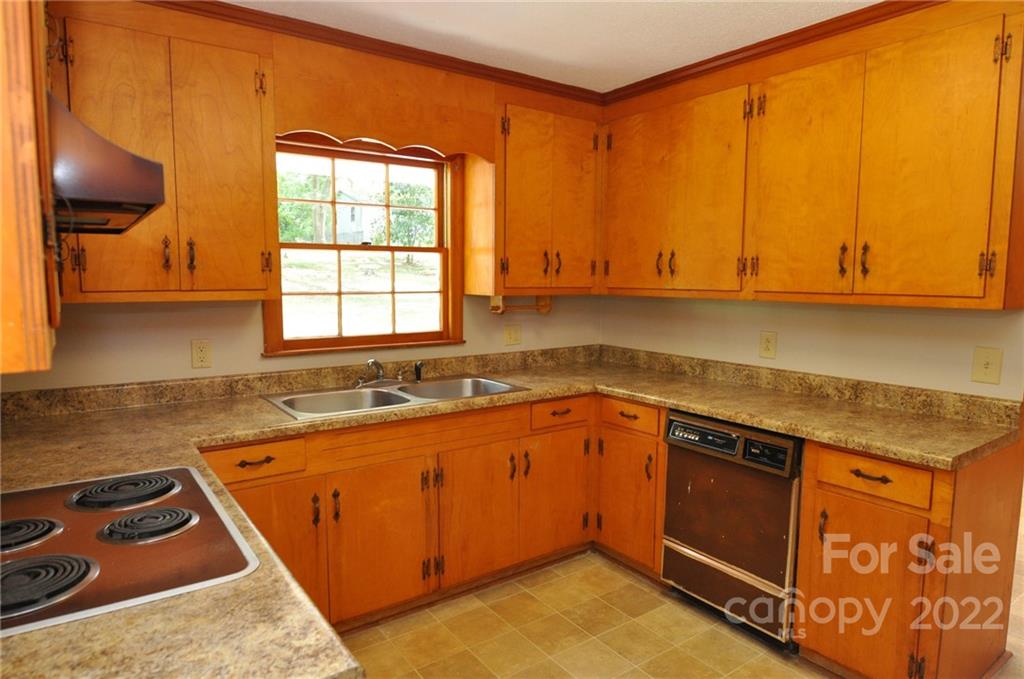 103 Sunset Drive Chester, SC 29706 - Photo 4 of 19 a kitchen with a sink a stove and cabinets