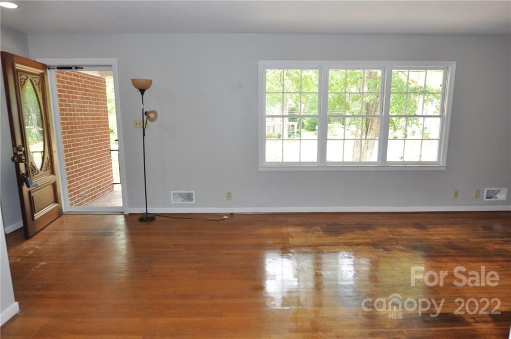 103 Sunset Drive Chester, SC 29706 - Photo 8 of 19 a view of empty room with wooden floor and fan