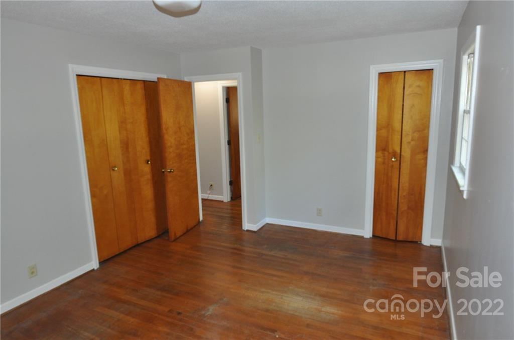 103 Sunset Drive Chester, SC 29706 - Photo 10 of 19 an empty room with wooden floor and closet