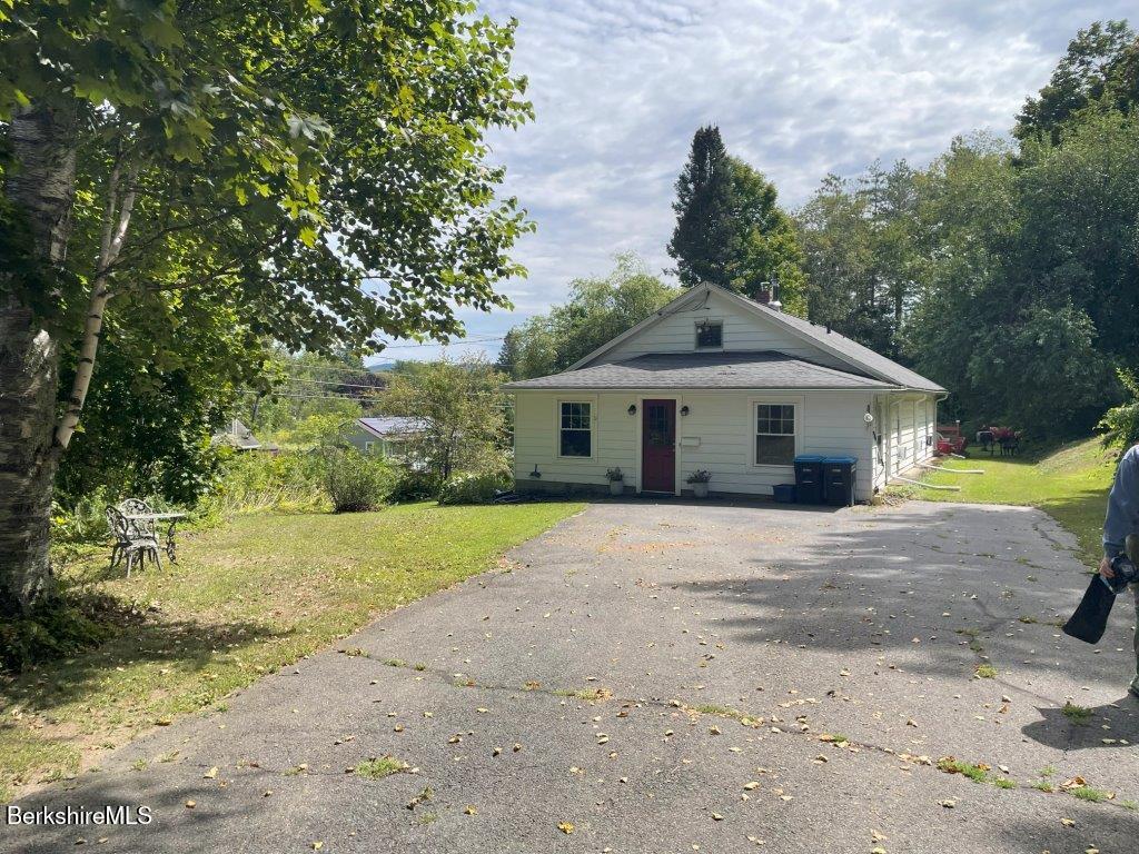 193 South Mountain Road Pittsfield, MA 01201 - Photo 1 of 49 a front view of a house with a yard and garage